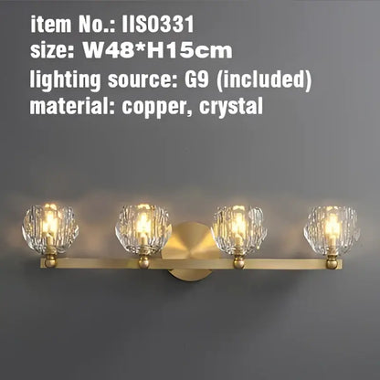 Gold brass vanity light fixtures with four faceted crystal globe shades for bathroom use