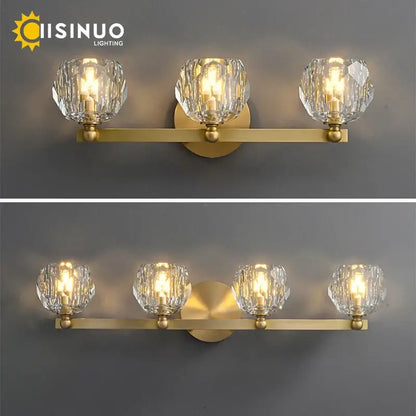 Gold-toned brass vanity light fixture with three faceted crystal shades for bathroom vanity light fixtures