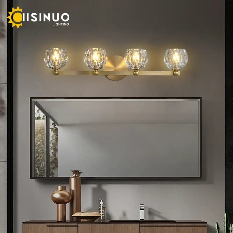 Gold brass vanity light fixtures with four faceted crystal glass shades for bathroom wall mounting