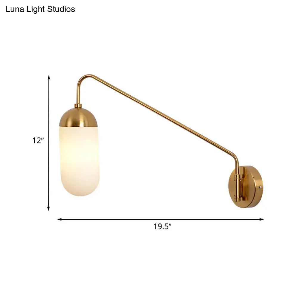 Gold brass wall lamp with a frosted glass wall shade designed as an elegant glass wall sconce for bedroom use