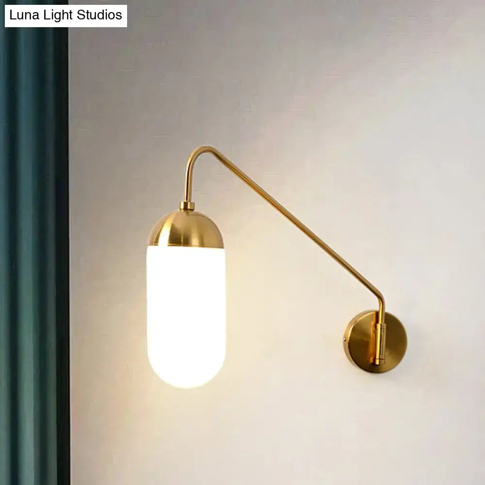 Gold brass frosted glass wall lamp with sleek curved arm and frosted glass wall sconce for bedroom lighting