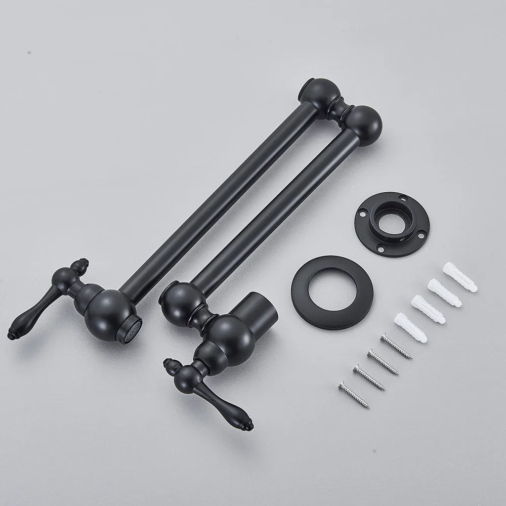 Black matte wall-mounted kitchen faucet set with ornate handles and spherical accents for elegant pot filling