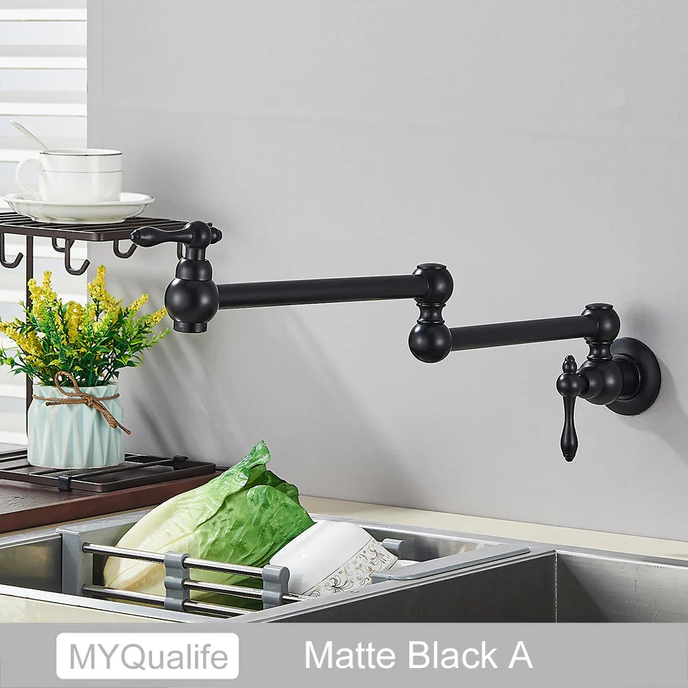 Matte black extendable kitchen faucet with ornate spherical accents and classic design for gold brass pot filler wall mounted use