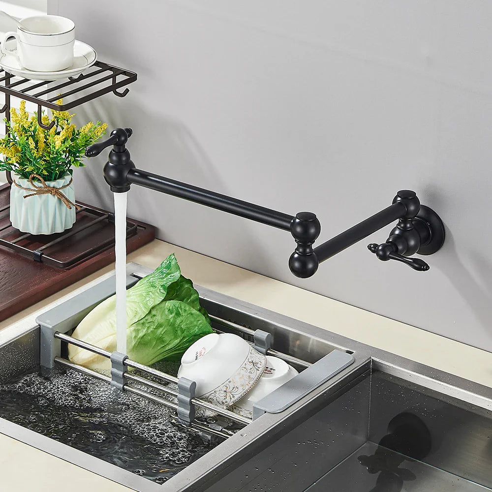 Black matte wall-mounted kitchen faucet with extendable gooseneck and dual handles in gold brass pot filler style