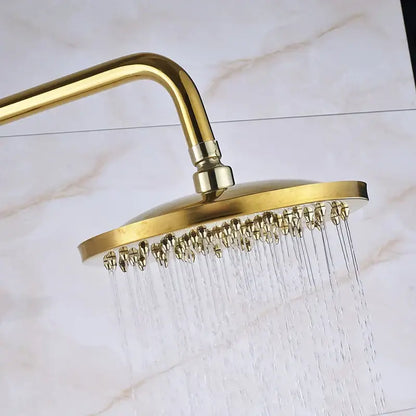 Gold brass rainfall shower faucet set with a round gold-colored showerhead featuring multiple water jets and metallic finish