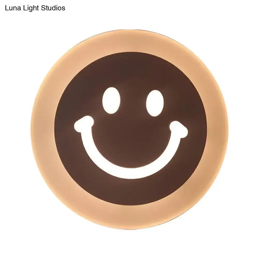 Gold and brown crescent led wall light with glowing white eyes for children’s bedroom wall light and sconce