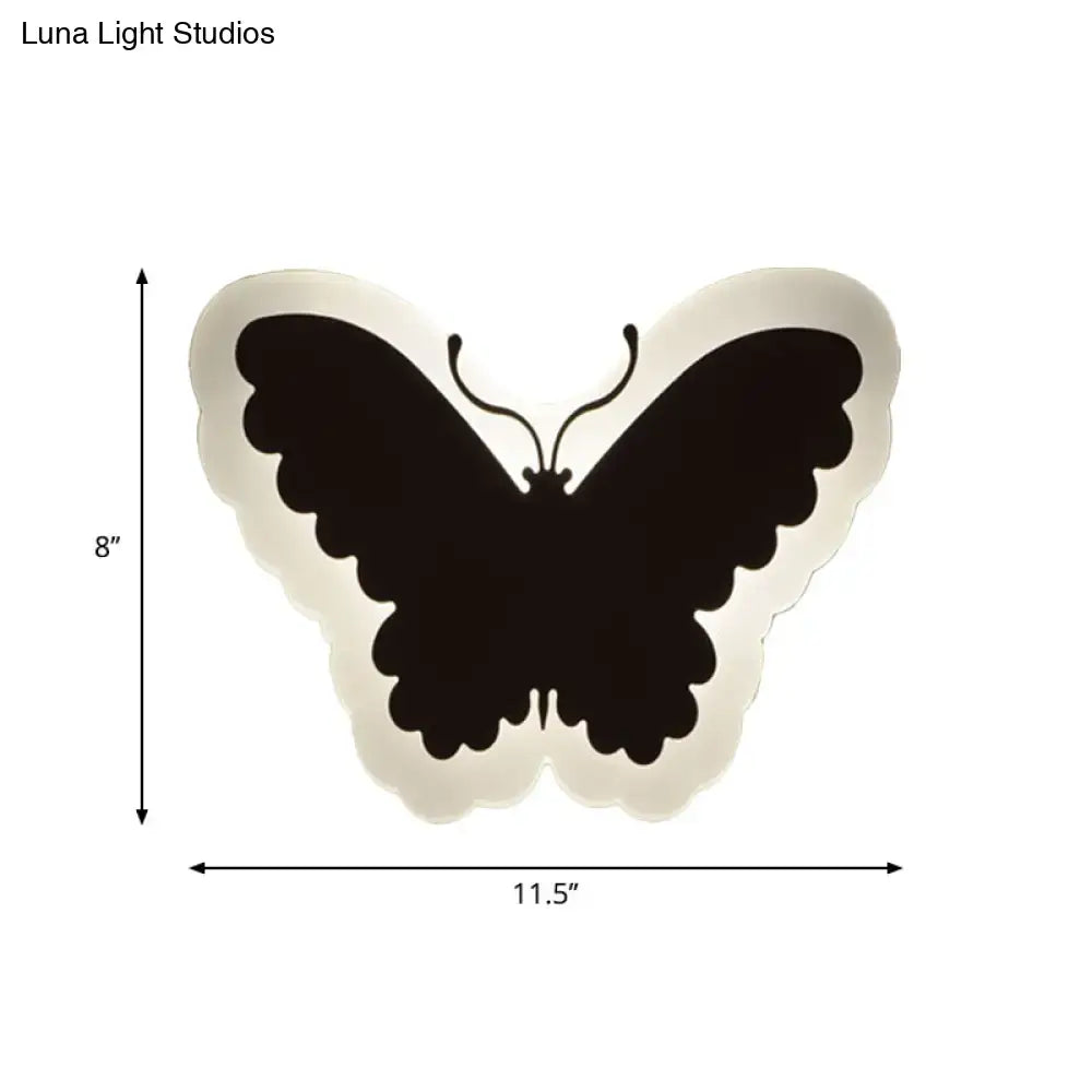 Black butterfly-shaped wall light with soft white glow ideal for children’s bedroom wall lights and decor