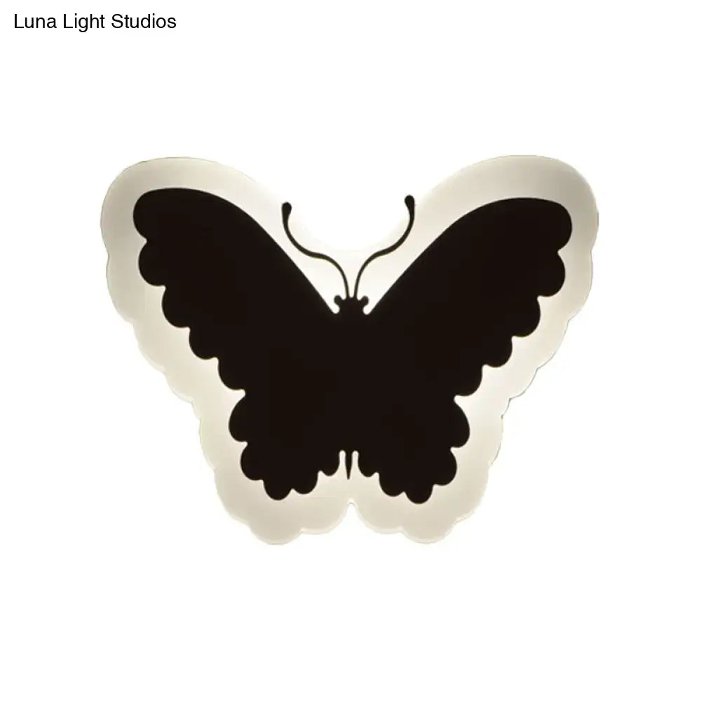 Black butterfly-shaped wall light with scalloped edge and minimalist design for children’s bedroom wall lights