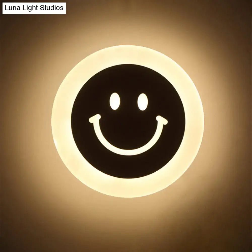 Gold and brown crescent led wall light with a black smiley face design for children’s bedroom wall lights