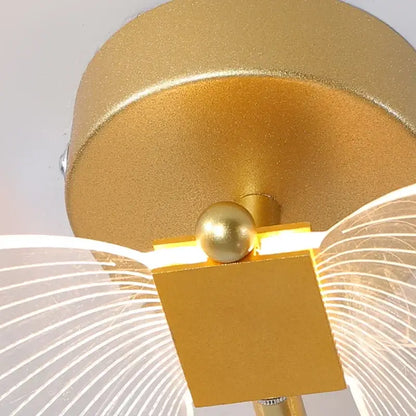 Gold butterfly wall lamp with gold finish square base spherical accent and translucent wing diffusers decorbites butterfly wall
