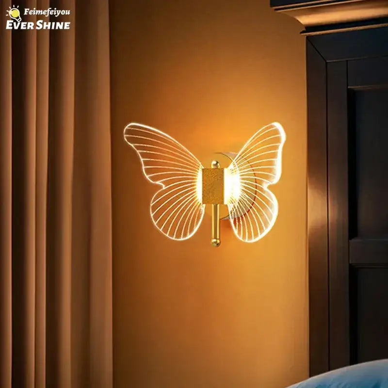 Gold butterfly wall lamp with translucent illuminated wings and sleek metallic base for bedroom decorbites butterfly wall decor