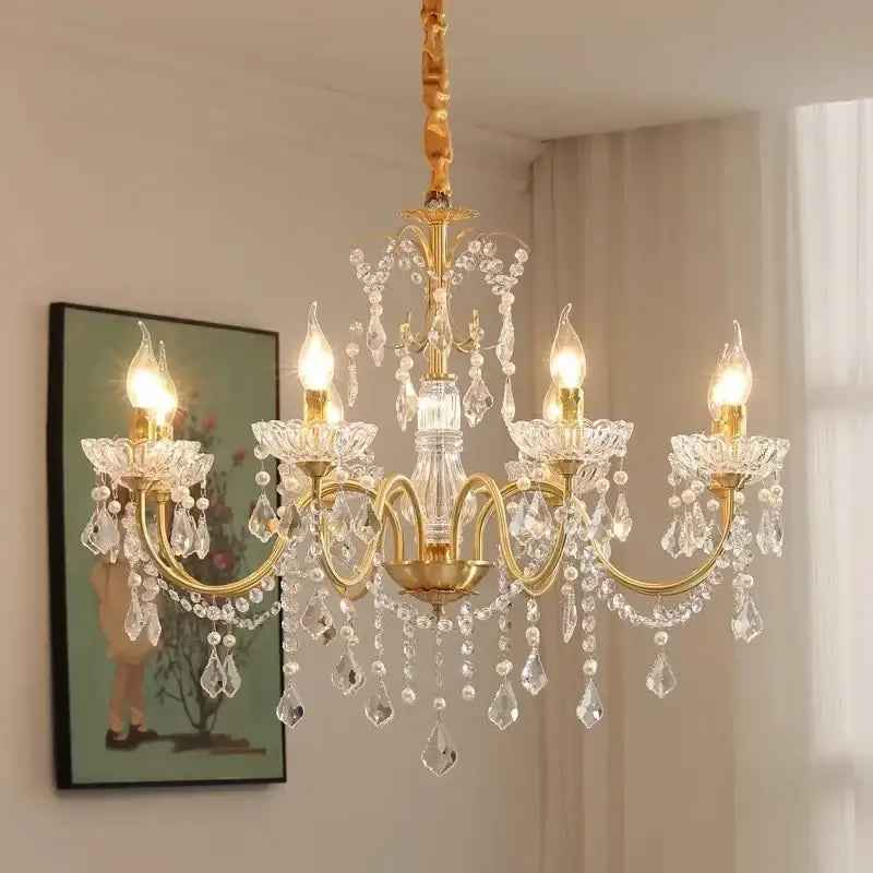 Elegant gold-toned decorbites crystal chandelier light with crystal droplets and floral-shaped arms for dining room decor