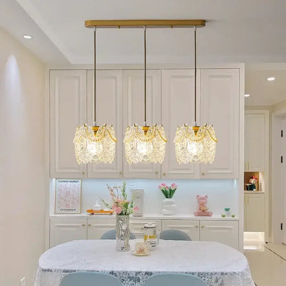 Three elegant gold-toned carved glass pearl pendant lights with intricate crystal lace shades for dining room decorbites chandelier