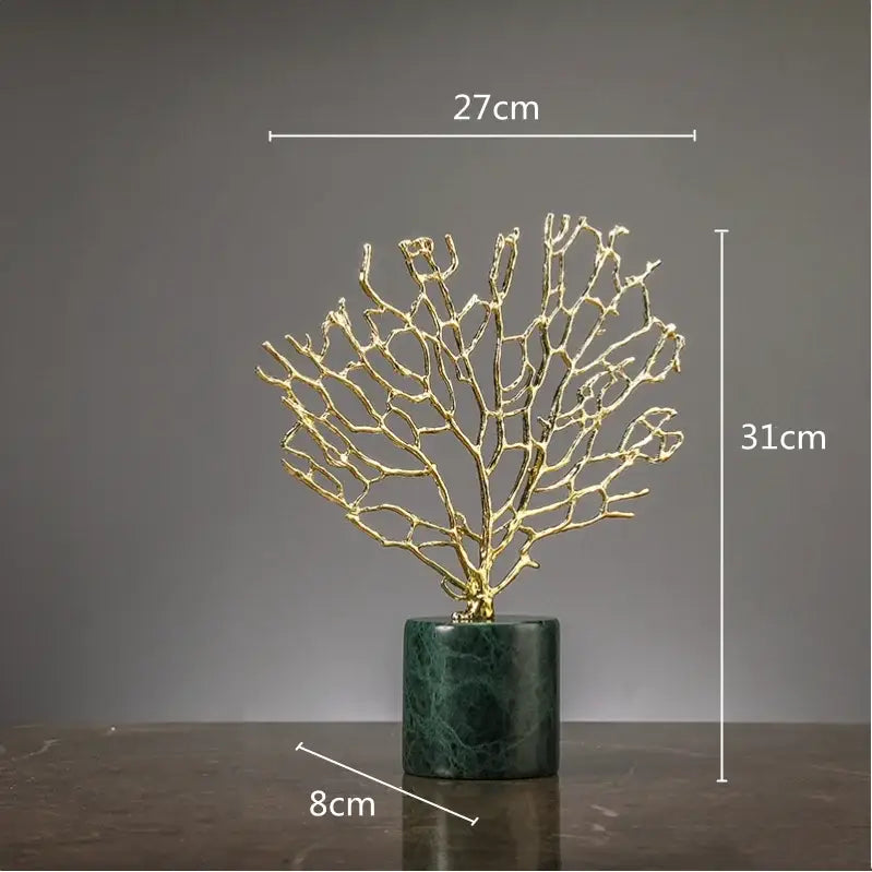 Golden metallic coral crystal tree sculpture with intricate branches on dark green marble base for living room decor