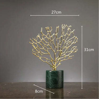 Golden metallic coral crystal tree sculpture with intricate branches on dark green marble base for living room decor