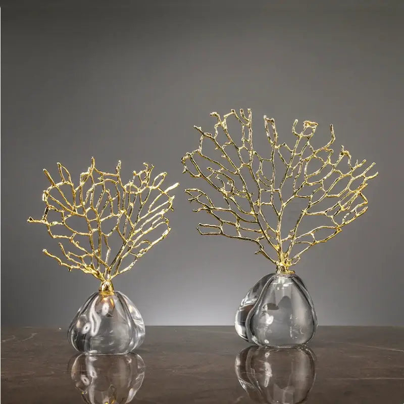 Two elegant gold coral crystal tree glass sculptures with resin ocean figurines on clear teardrop bases for decor