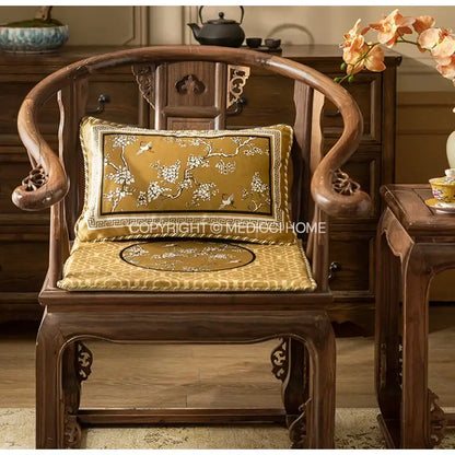 Elegant dark wood chinese-style chair with golden-yellow embroidered cushion featuring crane birds branches design