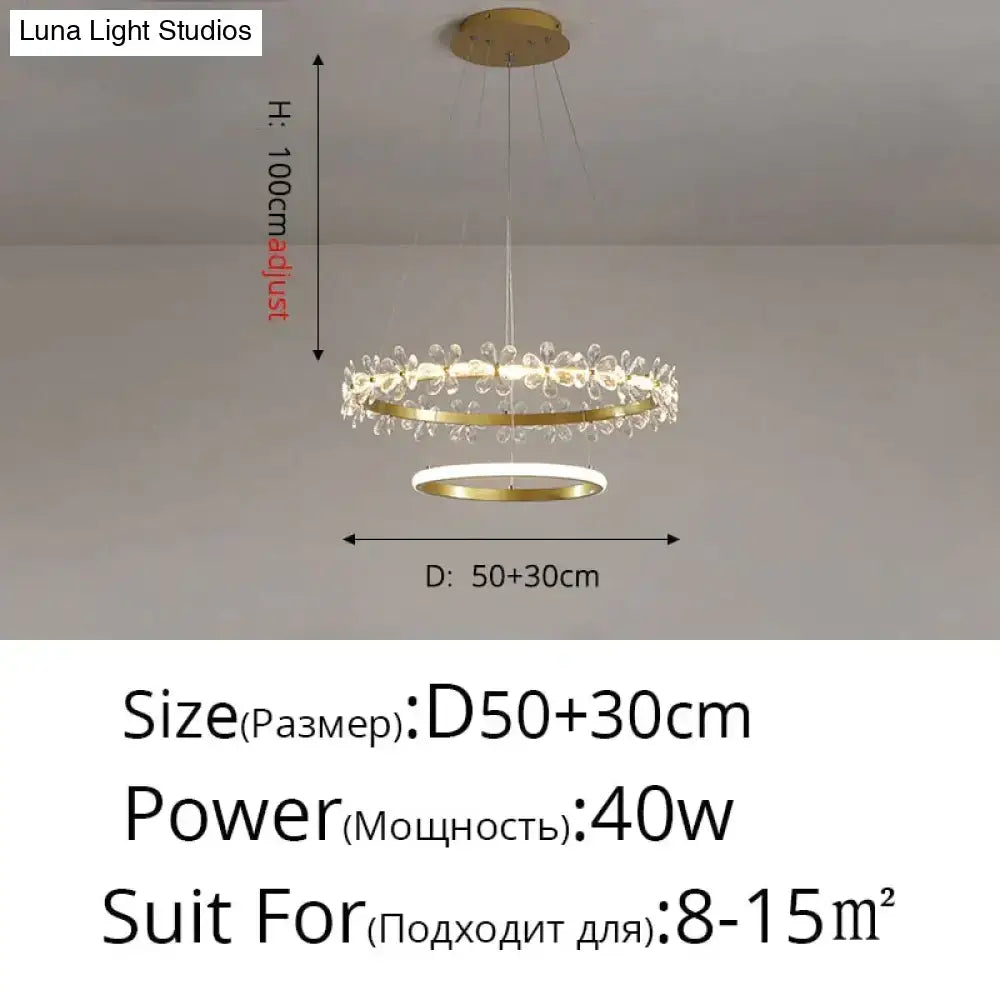 Gold-toned DecorBites Nordic style crystal flower pendant light with double rings and clear crystal droplets in a modern design