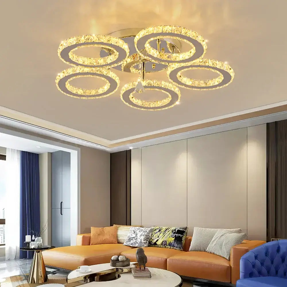 Gold-toned decorbites crystal led ring chandelier with five illuminated circular tiers for dining room decor