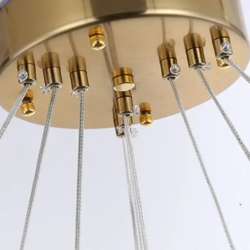 Gold-toned crystal oval pendant chandelier with brass sockets and silver braided cords for dining room decorbites crystal oval