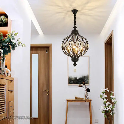Black wrought iron pendant lights with art design crystal accents from decorbites art design for kitchen chandelier