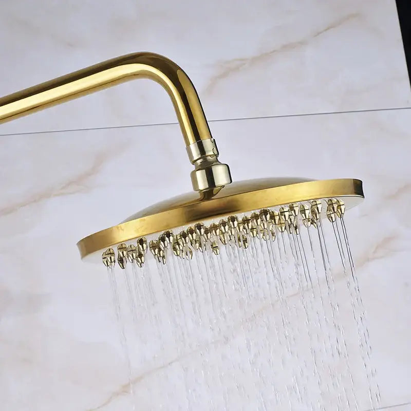 Gold dual handle rainfall shower system with ceramic handles featuring a round gold rainfall shower showerhead