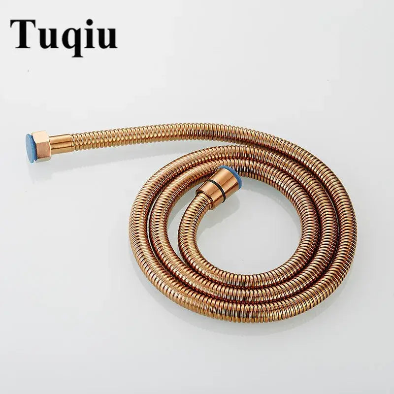 A coiled copper-colored flexible shower hose with blue caps made of stainless steel for bathroom brass fittings