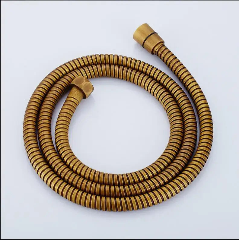 Gold flexible stainless steel shower hose with ribbed design and brass fittings for bathroom use