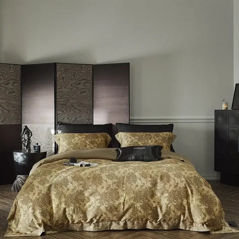 Gold floral satin cotton bedding set featuring a floral pattern with matching pillows and a black accent pillow