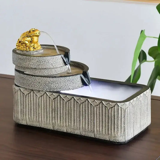 Gold frog flowing water garden ornament with cascading tiers and textured stone base for fish pond tank use