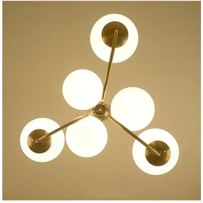 Modern brass ball led pendant chandelier with five glowing white frosted glass ball shades for kitchen lighting decorbites glass ball
