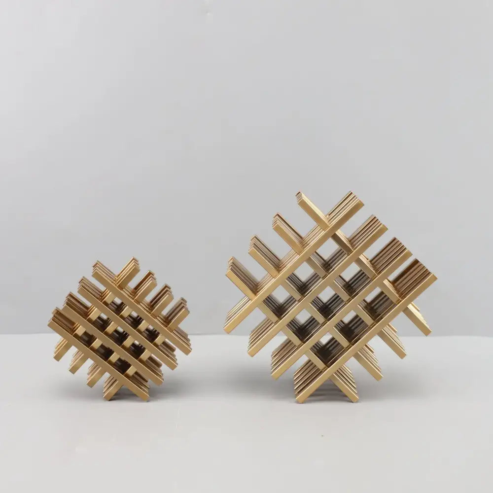 Gold geometric block metal wine rack with intersecting slats forming a lattice pattern for decorbites geometric block decor