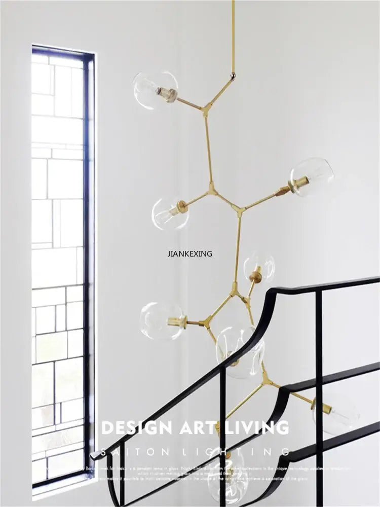 Gold-toned molecular branching staircase chandelier with clear glass bulbs for dining room decorbites glass branching light