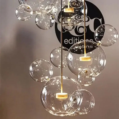 Gold glass bubble led chandelier with clear glass bubbles and gold-toned metal accents for dining room lighting decorbites glass bubble