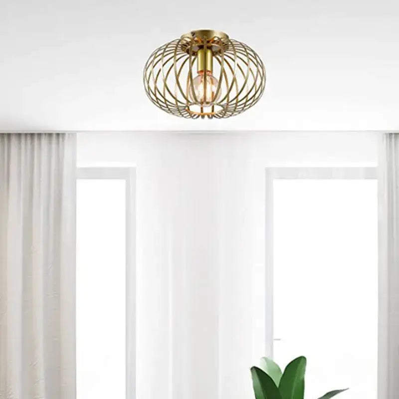 Gold iron art ceiling light with brass wireframe design and warm glowing bulb for living room decorbites iron art ceiling