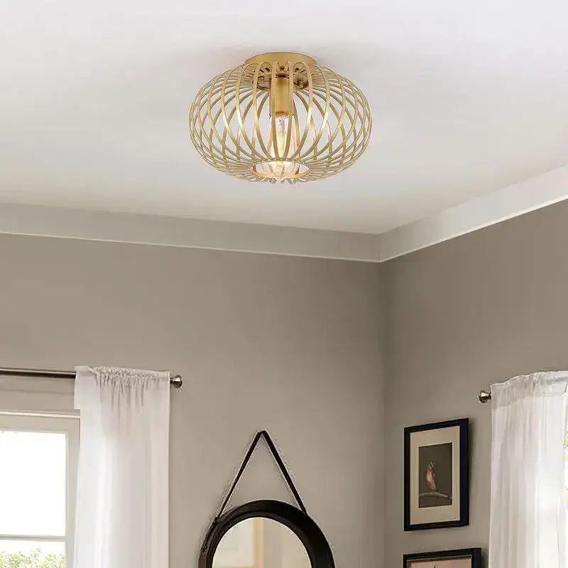 Gold-toned decorbites iron art ceiling light with woven wireframe design and visible bulb for living room decor