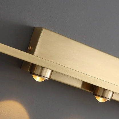 Brass-finished rectangular wall sconce with two exposed bulbs warm glow iron art mirror decorbites bathroom light