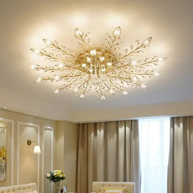 Gold-toned decorbites crystal ceiling light fixture with leaf branch design and clear crystals for living room chandelier