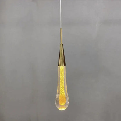 Gold liquid crystal drop pendant light featuring a clear glass teardrop with glowing beads for elegant decorbites crystal drop decor