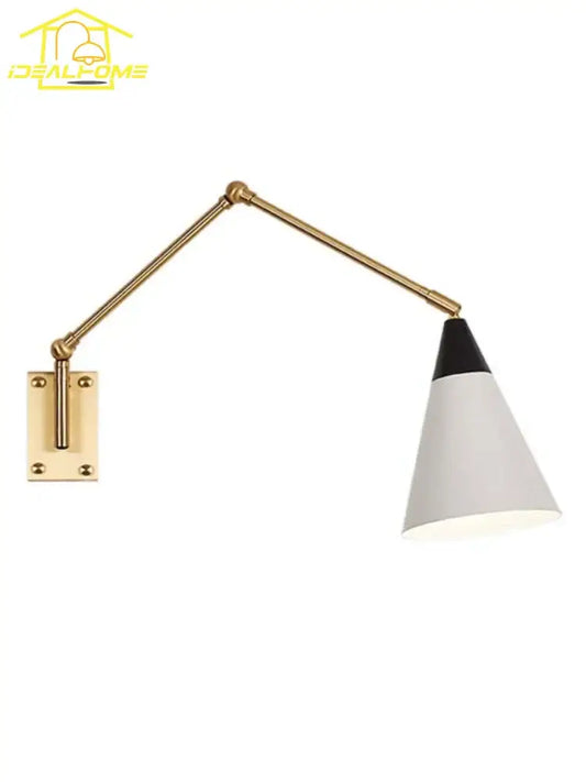 A sleek gold lustre brass swing arm wall lamp with a white conical shade for bedroom decorbites wall lamp