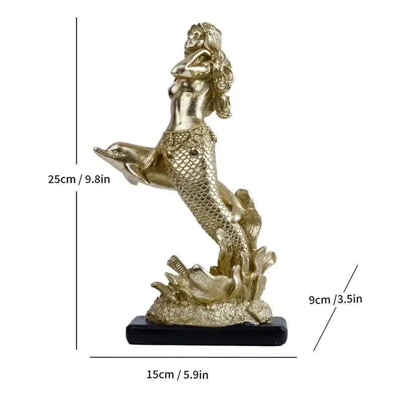 Golden mermaid statue resin sculpture with detailed scales and flowing hair standing on a dolphin on black base