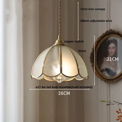 Gold petal glass led pendant lamp with brass frame and frosted glass panels in a vintage kitchen lighting fixture