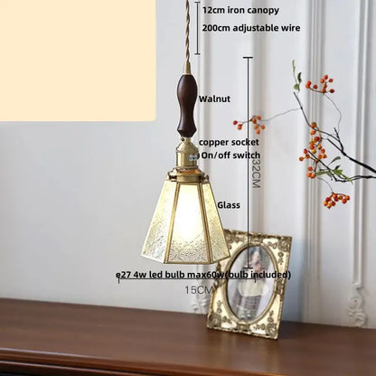 Gold petal glass led pendant lamp featuring a walnut wood handle, brass accents, and etched ornate glass shade