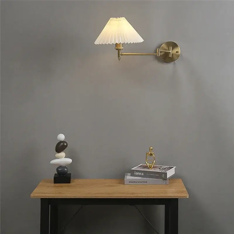 Brass wall lamp with pleated white fabric shade featuring decorbites adjustable led for bedroom reading light