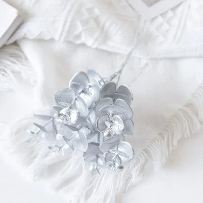 Silver metallic eucalyptus leaves cluster with glossy reflective leaves in gold silver and green artificial plants decorbites eucalyptus leaves