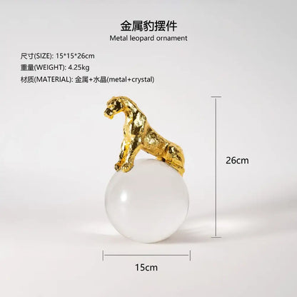 Gold metal leopard crystal ball decorbites leopard crystal sculpture atop a translucent white sphere for living room decor