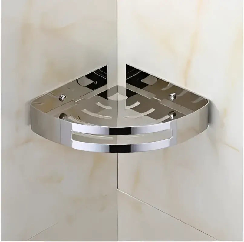 Chrome finished triangular corner shelf with perforated surface for drainage in decorbites gold stainless steel design