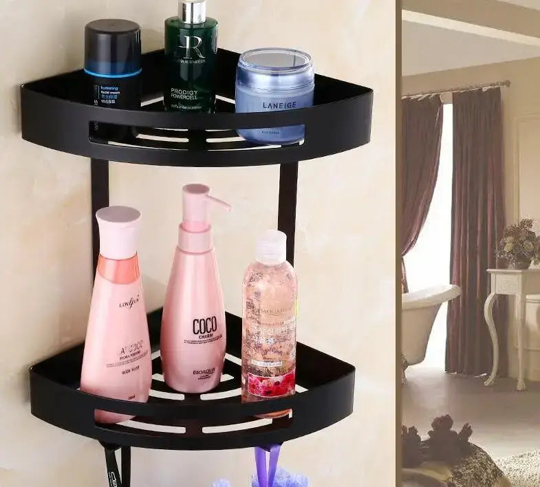Black double-tiered corner shelf with perforated shelves in stainless steel for decorbites gold stainless bathroom use