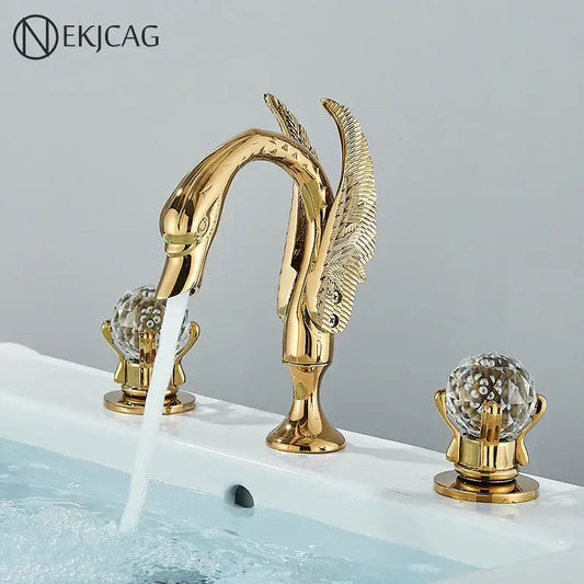 Gold swan crystal handle bathroom faucet with swan shape, crystal globe handles, and feathered decorbites gold swan design