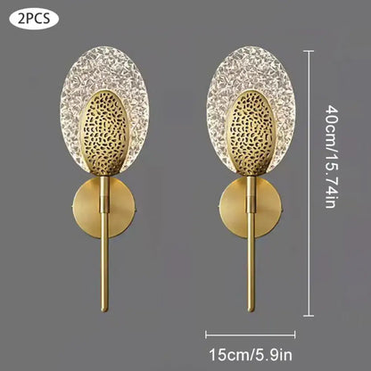 Gold-toned led wall lamp with textured glass and oval crystal panels for elegant indoor lighting in bedrooms